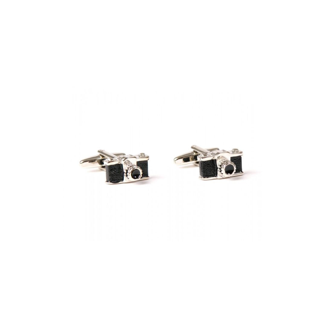 Camera-shaped cufflinks on a white background