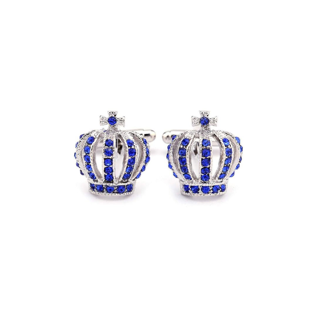 Crown-shaped cufflinks with blue gemstones on a white background