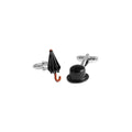 Cufflinks shaped like an umbrella and a top hat on a white background