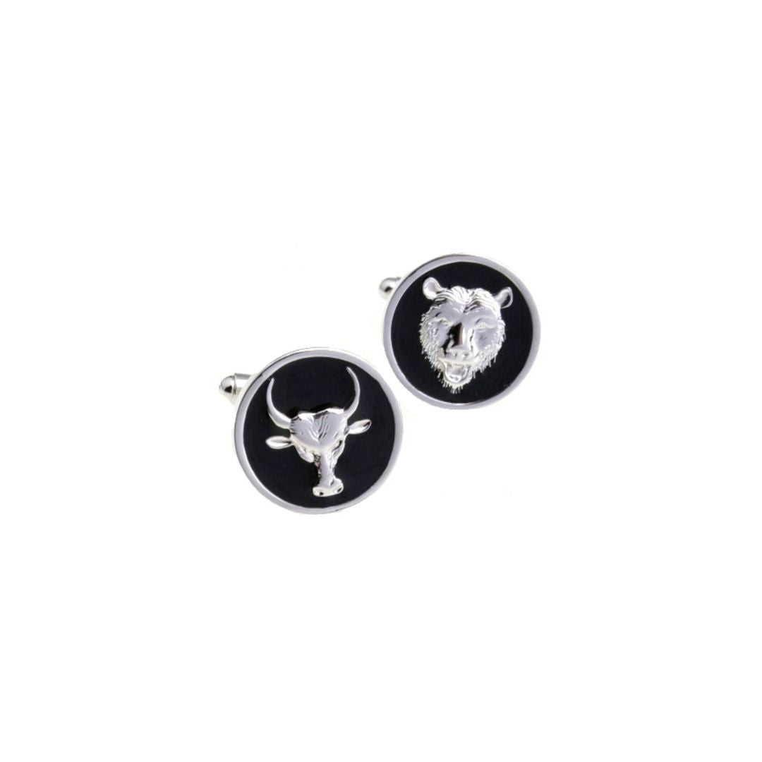 Cufflinks with bull and bear design on a black background