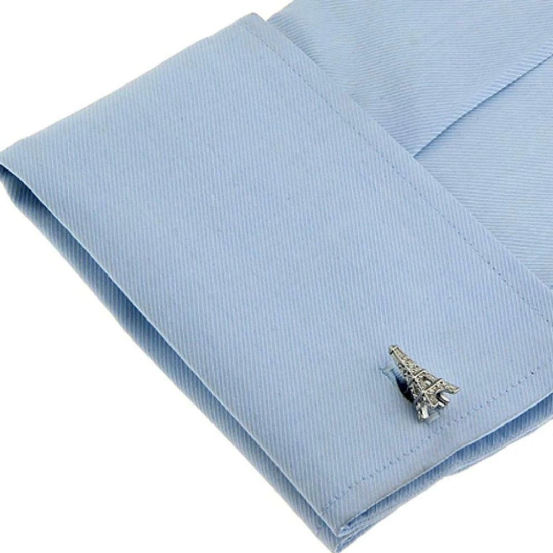 Eiffel Tower cufflink on a blue shirt