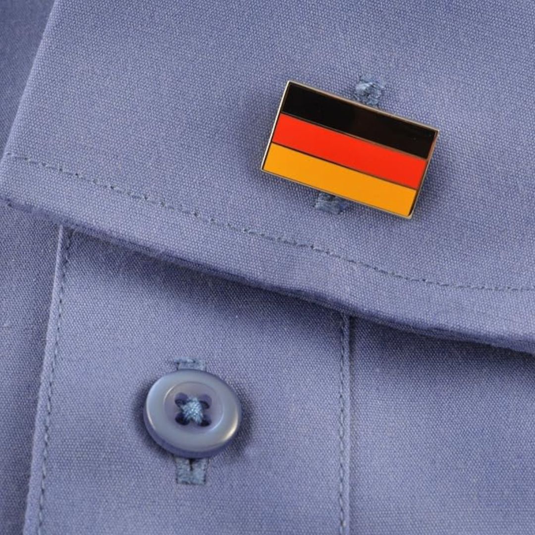German flag cufflink on a light blue shirt