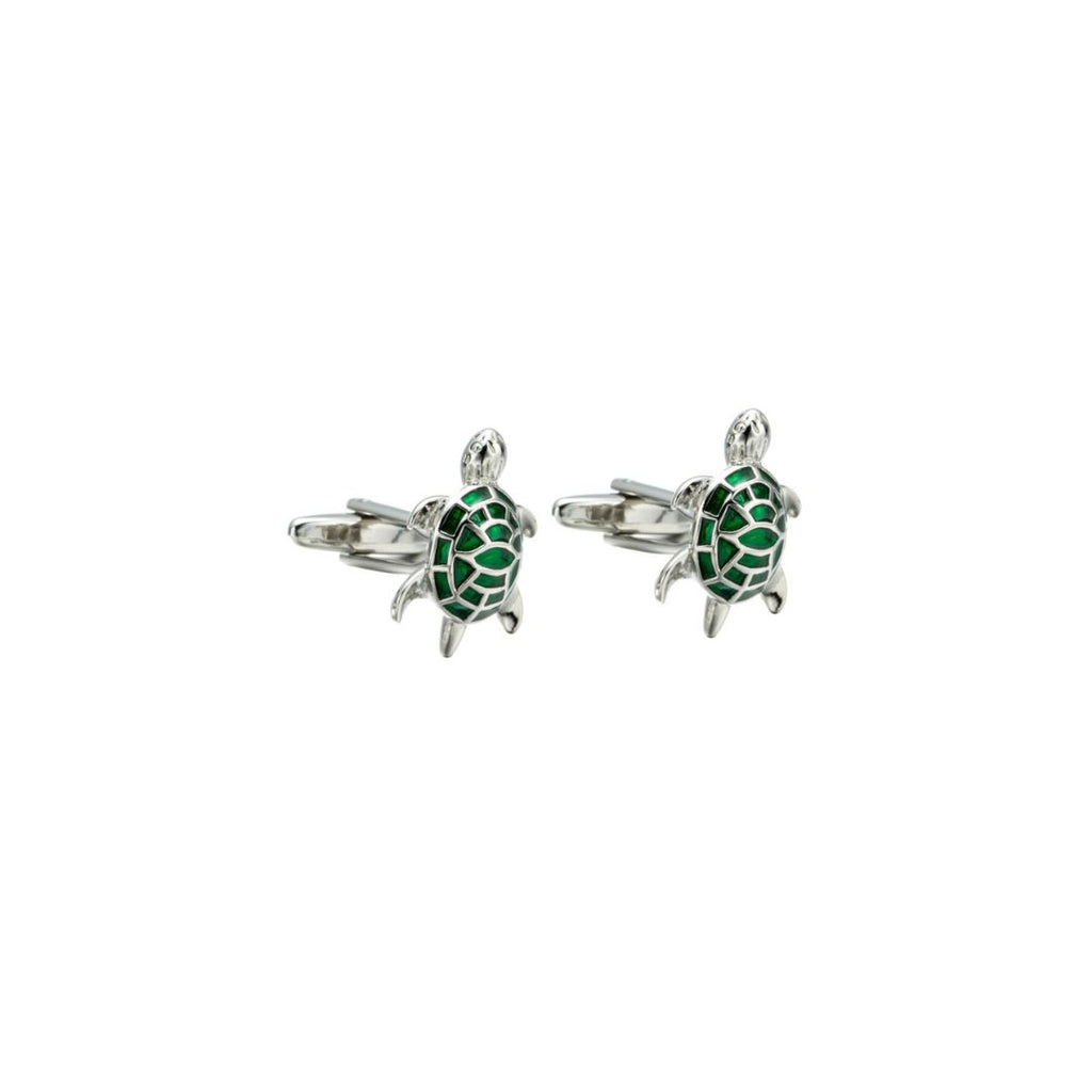 Turtle-shaped cufflinks with green details on a white background