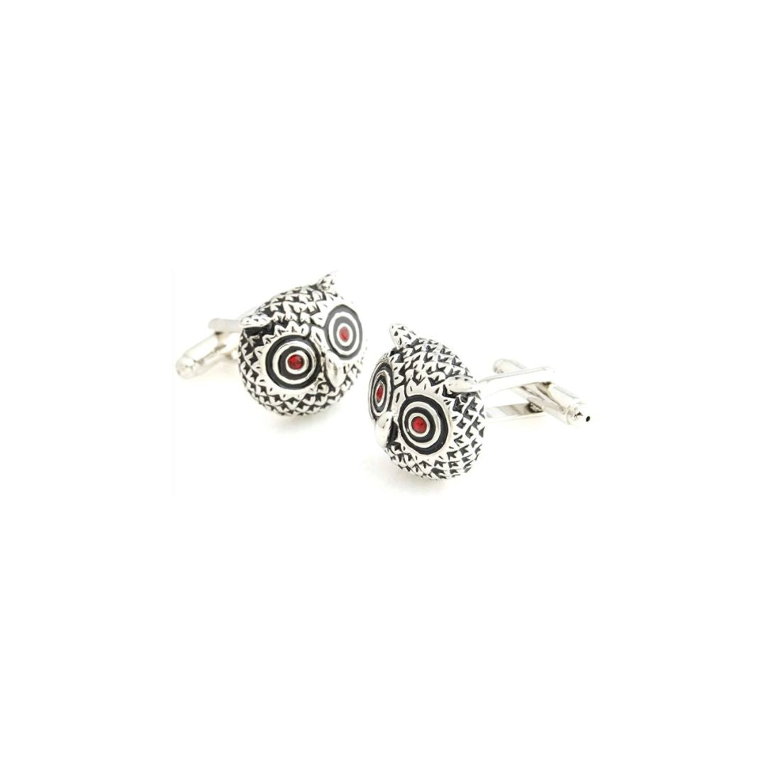 Pair of owl-themed cufflinks on a white background