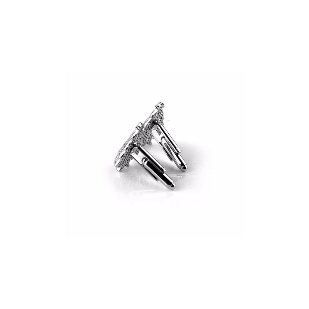 Pair of silver christmas tree cufflinks on a white background