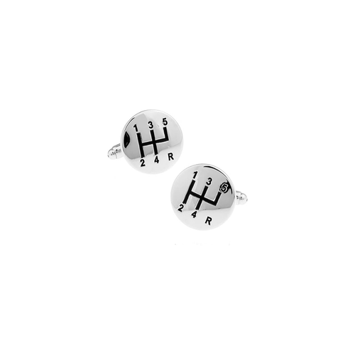 Pair of silver cufflinks with gear shift design on a white background