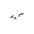 Pair of silver golf ball cufflinks on a white background