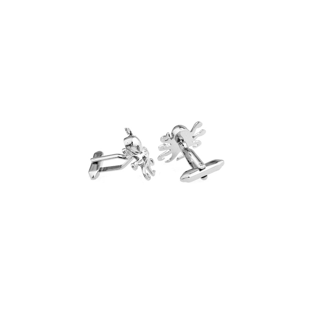 Pair of silver octopus cufflinks on a white background
