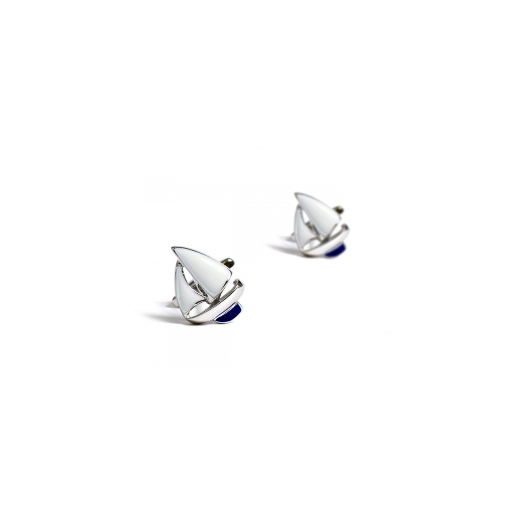 Pair of silver white sailboat earrings on a white background
