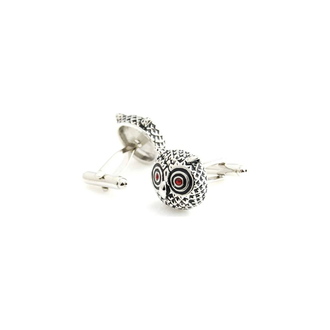 Silver cufflinks with an owl design on a white background