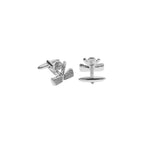 Silver golf clubs and golf ball cufflinks on a white background
