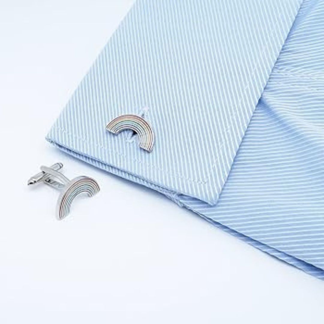 Silver rainbow cufflinks on a light blue striped shirt 