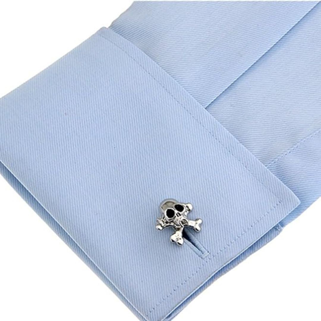 Skull and crossbones cufflinks on a light blue shirt