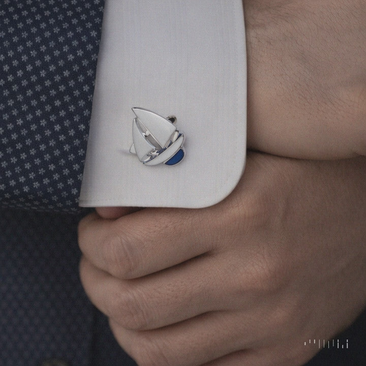 white sailboat on a blue suit