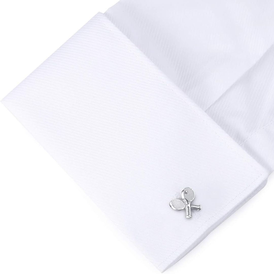 silver tennis rackets on a white shirt