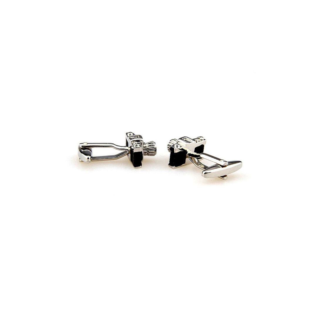 vintage camera cufflinks from the back on a white background
